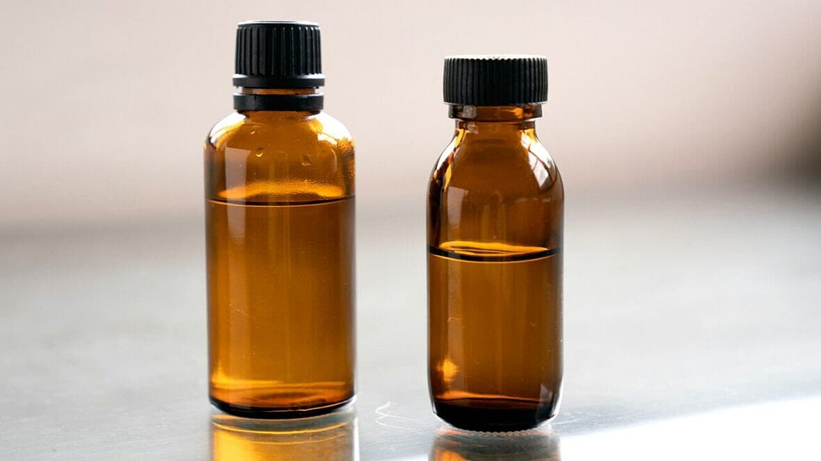 brown bottles with liquid inside