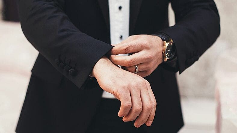 man fixing his suit
