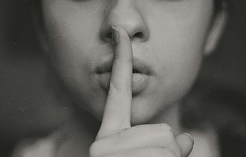 person shhing / secret societies