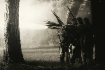 men shooting guns in the woods / civil war mysteries
