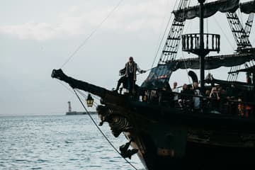 pirate standing on pirate ship / strange facts about pirates
