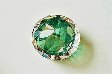 green faux jewel on white background / most famous jewels in history