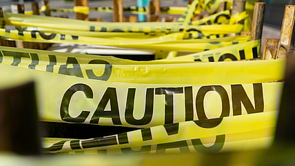 banned books considered too dangerous to read / yellow caution tape