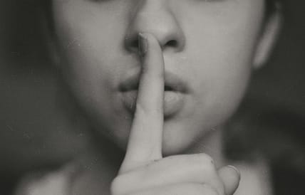 person shhing / secret societies