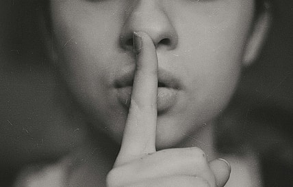person shhing / secret societies