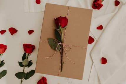 gift with rose on top / odd valentine traditions