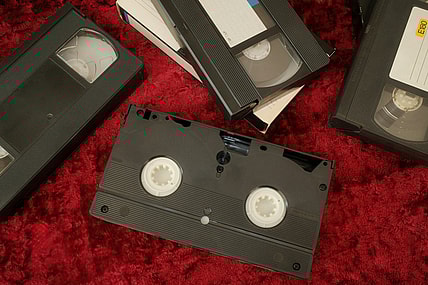 vhs tapes on red background / valuable christmas vhs tapes