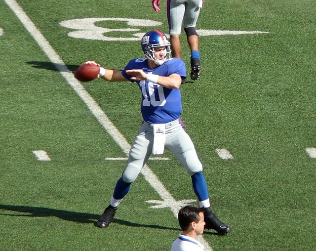 most valuable eli manning football cards