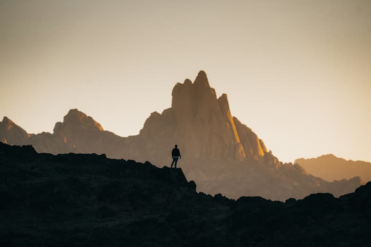 man exploring rock mountains / bizarre explorer stories