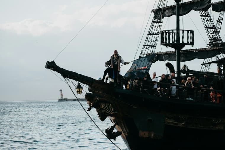 pirate standing on pirate ship / strange facts about pirates