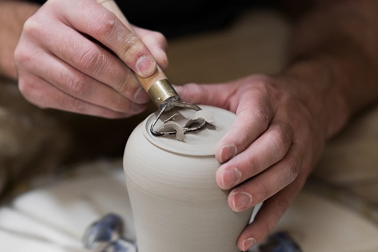 Potter clay throwing clay shaping vase, unsplash