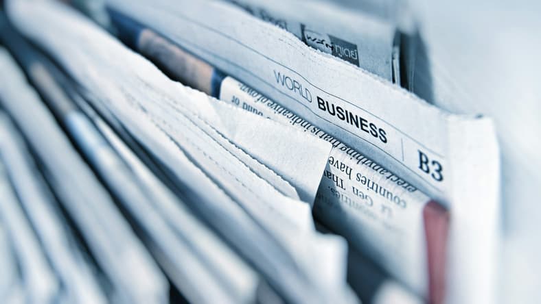 famous typos in newspapers and books / stack of newspapers