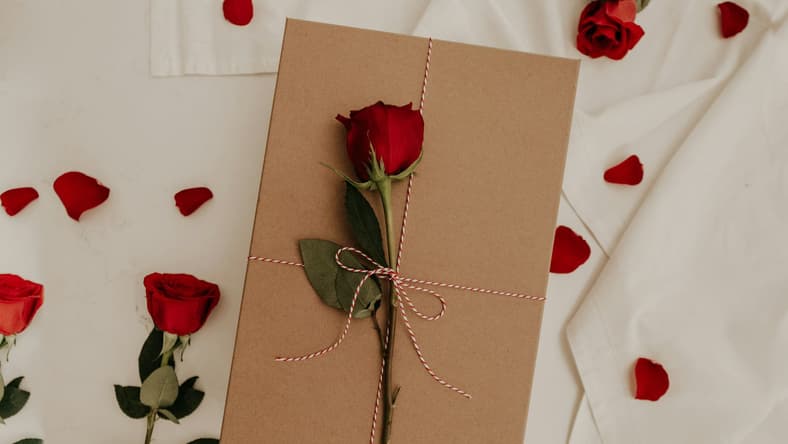 gift with rose on top / odd valentine traditions