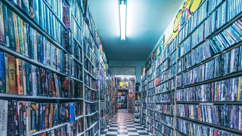 A collection of VHS tapes.