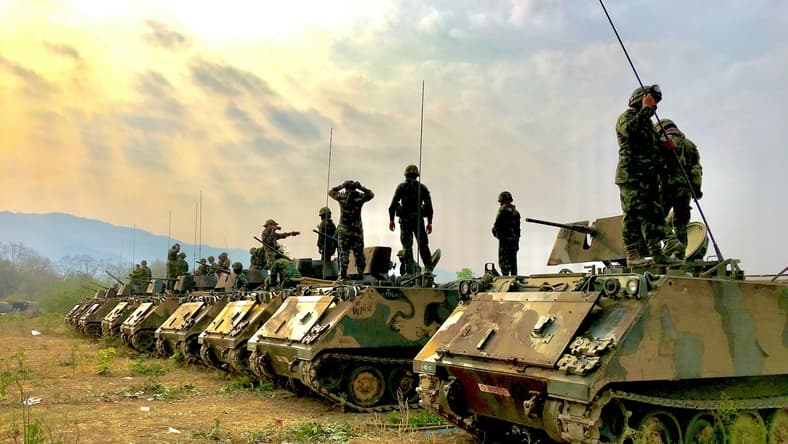 line of tanks and soldiers / wartime military technologies