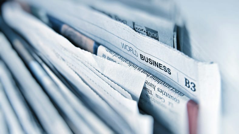 famous typos in newspapers and books / stack of newspapers
