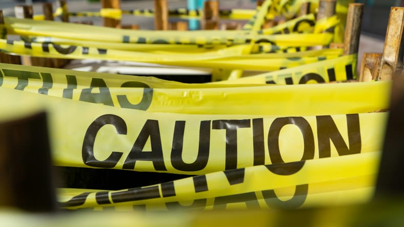 banned books considered too dangerous to read / yellow caution tape