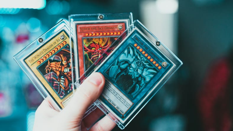 hand holding trading cards