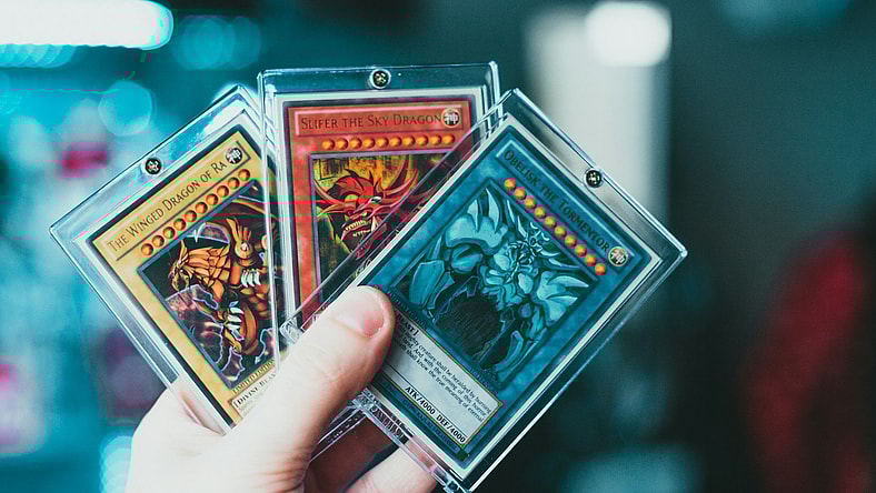 hand holding trading cards
