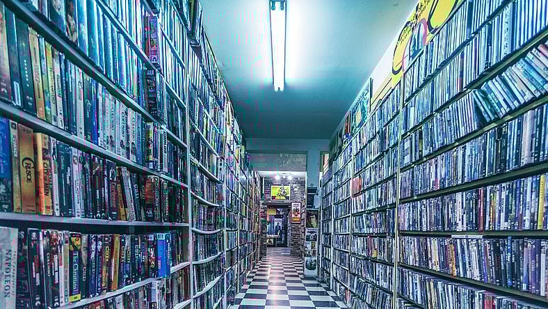 A collection of VHS tapes.