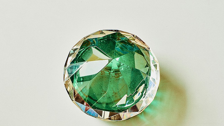 green faux jewel on white background / most famous jewels in history