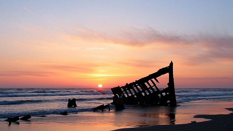 The wreck of the Peter Iredale in the Fort Stevens State Park, Oregon, USA, at sunset. Ran aground in 1906.