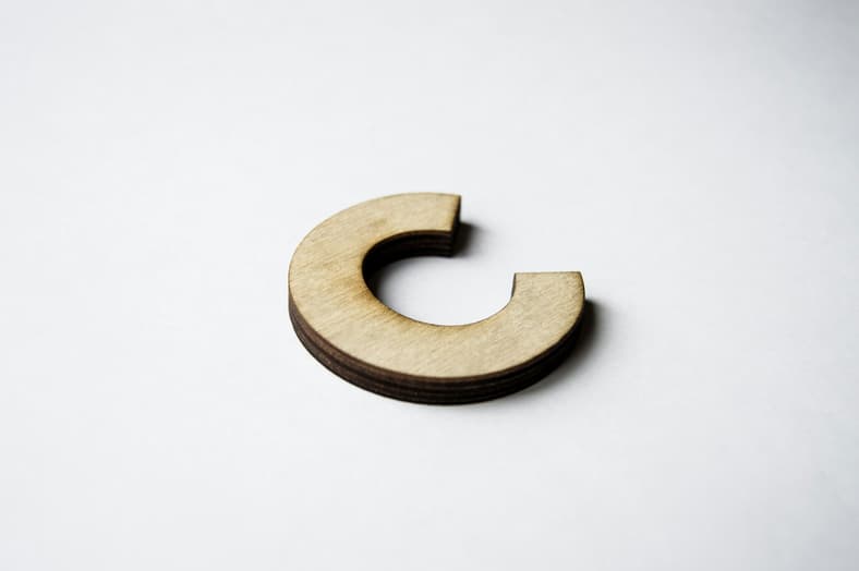 wooden c on white background