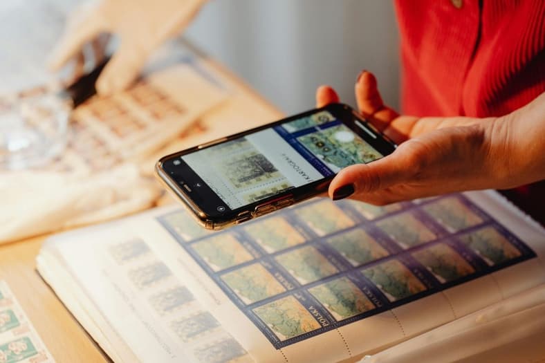 Looking at stamps via app. 