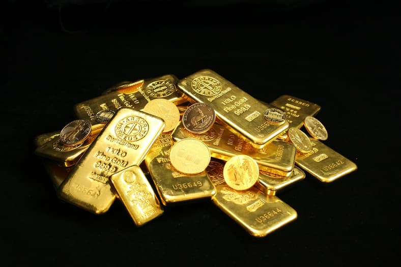 gold bars and coins black background
