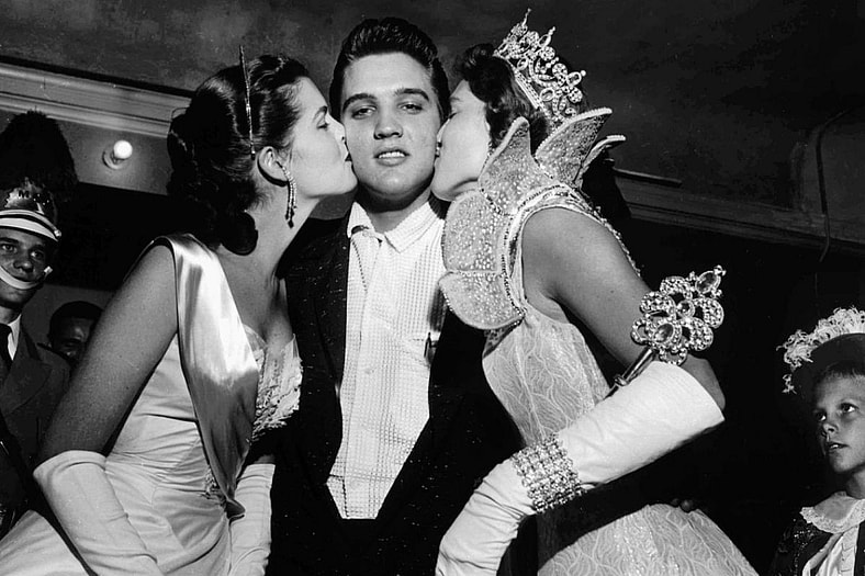Elvis Presley being kissed