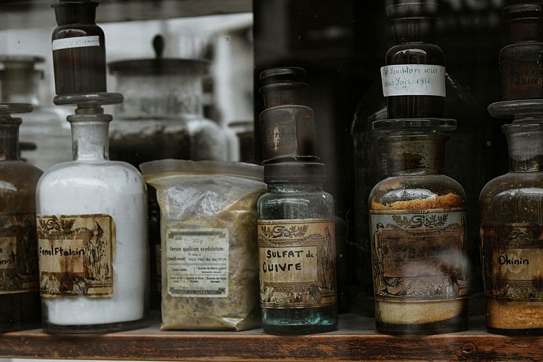 Antique bottles on shelf. 