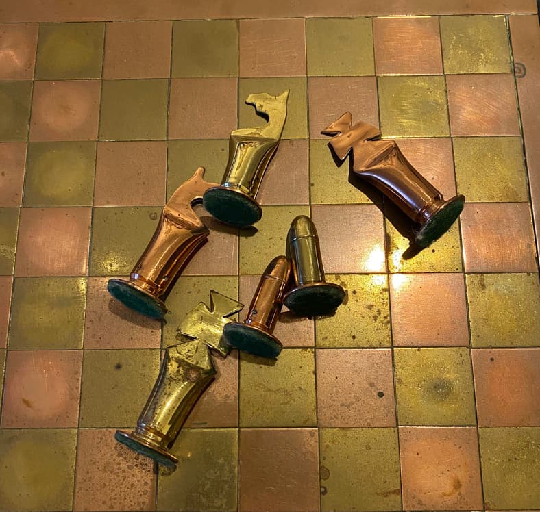 chess pieces made from bullets